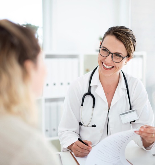 Smiling doctor treating patient at the top hospital in Amalapuram
